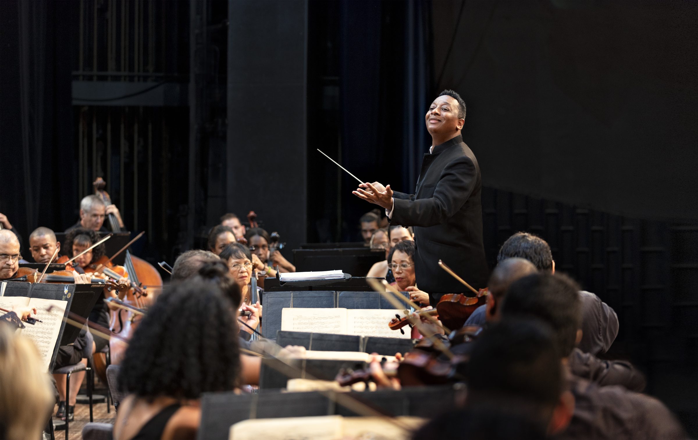 Marlon Daniel conducting an orchestra